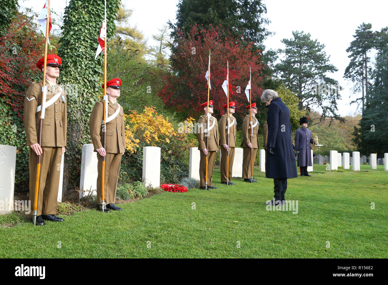 Prime Minister Theresa May at the St Symphorien Military Cemetery in Mons, with Belgian Prime Minister Charles Michel, laying a wreath at the grave of George Ellison, the last British soldier to be killed before Armistice in 1918. Stock Photo