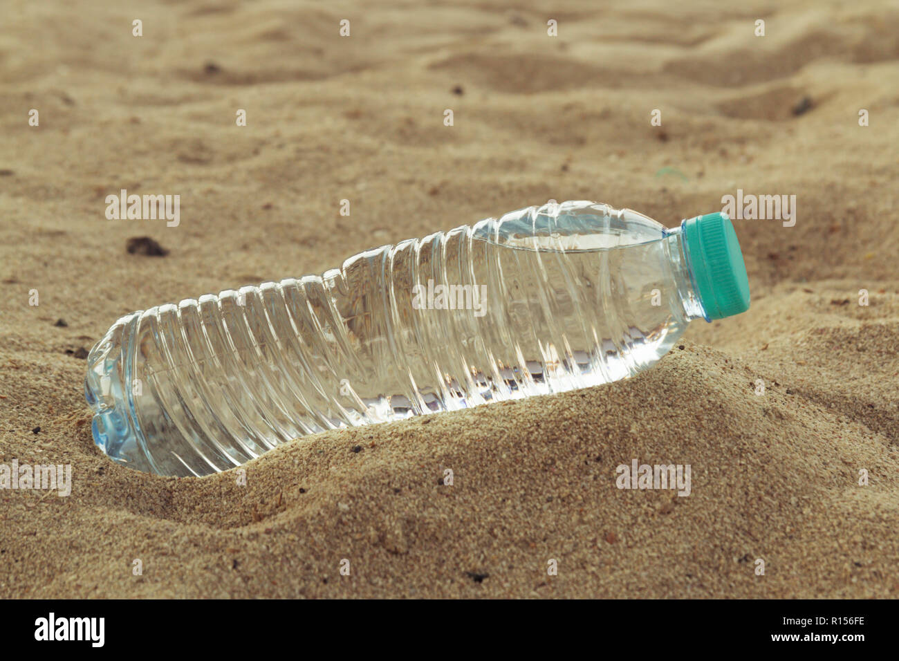 pet bottle with water on the desert Stock Photo