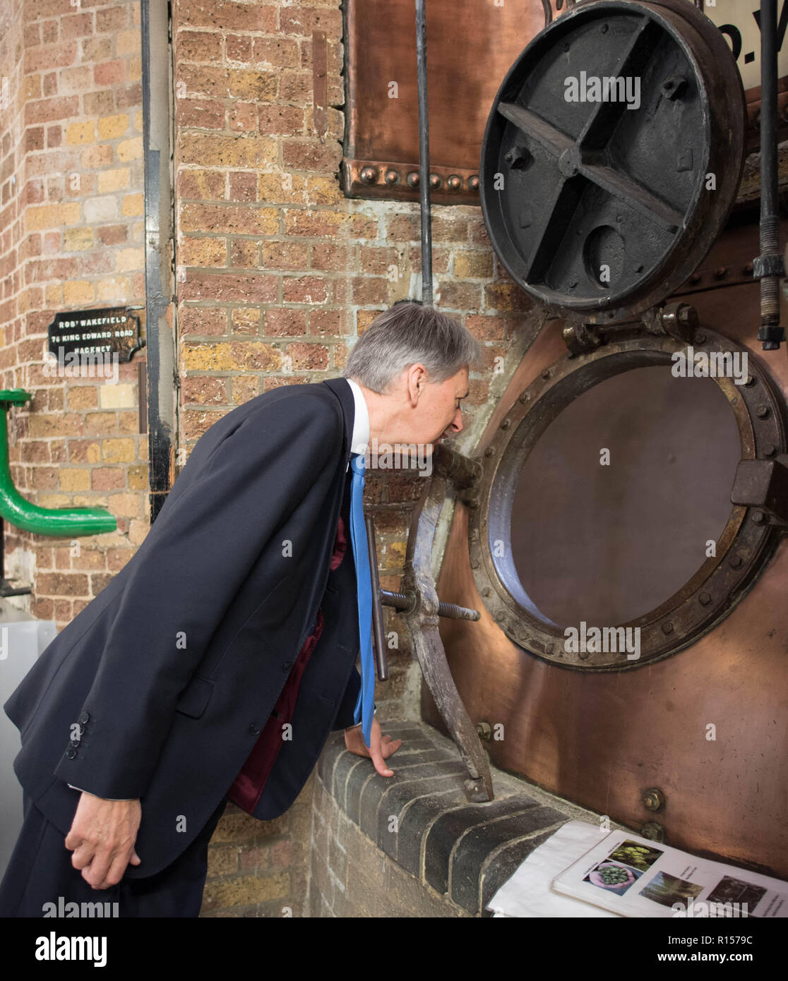 Chancellor Philip Hammond is shown around Fuller's Brewery, in Chiswick, London today ahead of the announcement of the third quarterly GDP figures by the Office For National Statistics. Stock Photo