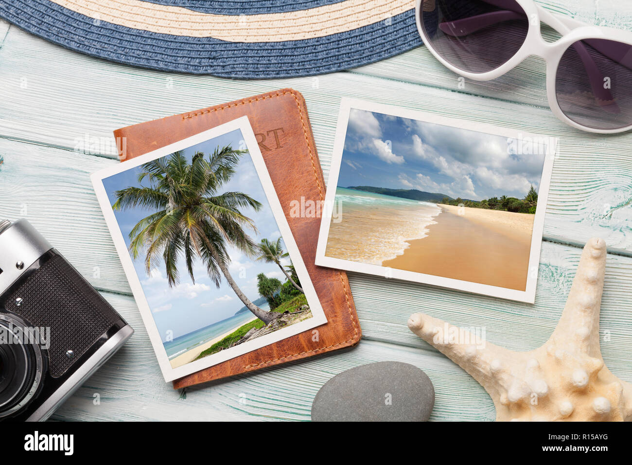 Travel vacation table concept with camera, passport and summer photos on wooden table. Top view. Flat lay. Photos taken by me. Stock Photo