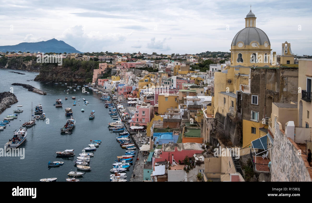 Bird's eye view from the cliff top of Marina Corricella, unspoilt fishing  village on the island of Procida Italy, with pastel coloured houses Stock  Photo - Alamy