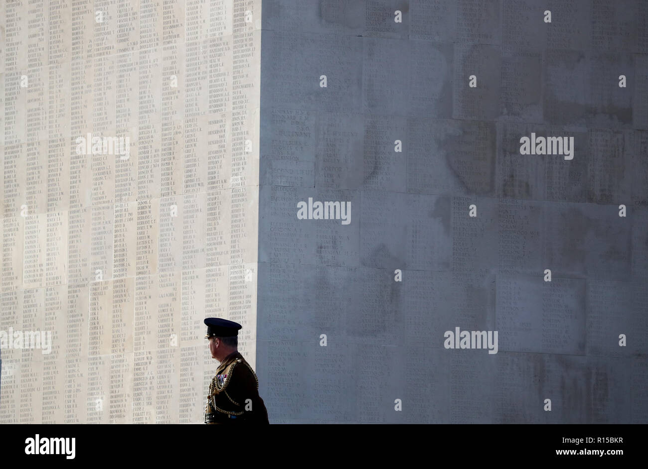 A soldier stands besides the wall of names, memorialising those who have no known grave, during a wreath laying ceremony at the Thiepval Memorial in Authuille, France. Stock Photo