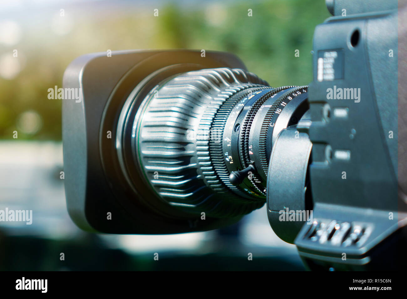 Video camera lens recording show in TV studio focus on camera