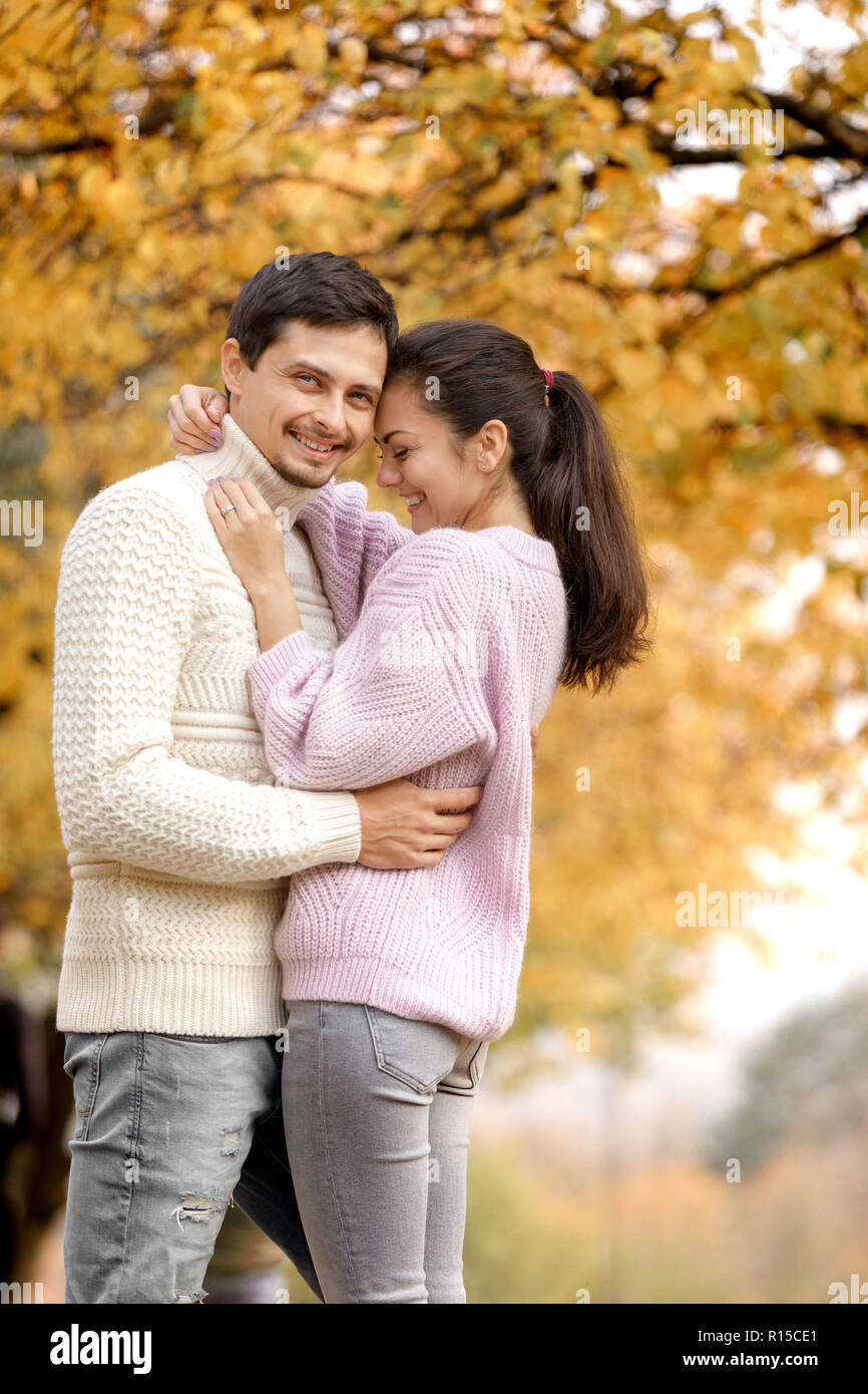 Couple in love in the autumn leaves Stock Photo - Alamy