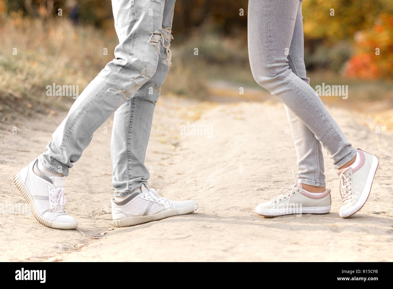 legs of couple in love kissing outdoor Stock Photo - Alamy