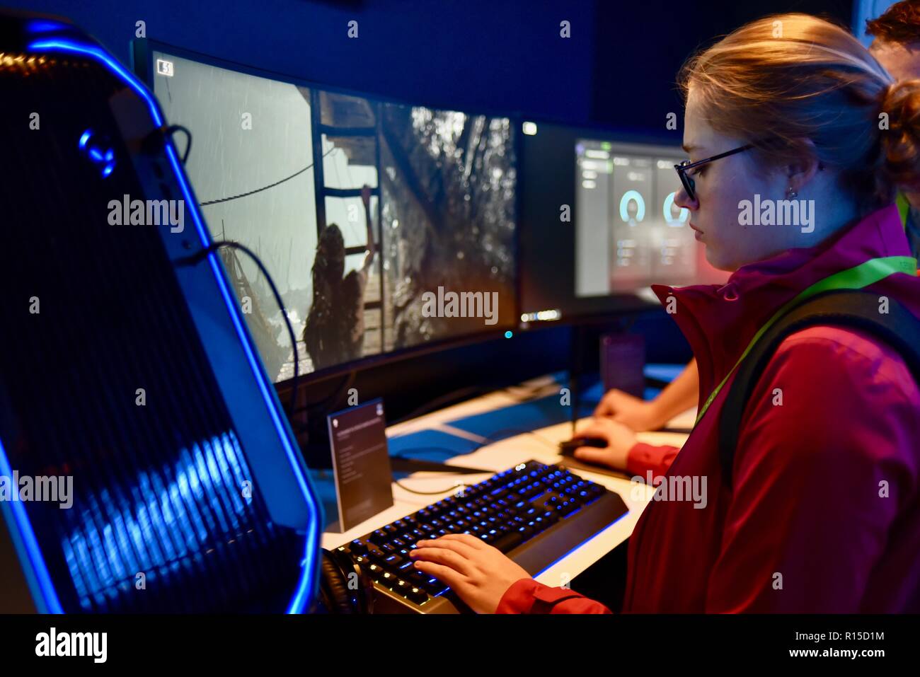 Young woman playing video game on Dell computer, CES (Consumer Electronics Show), the world’s largest technology trade show, held in Las Vegas, USA. Stock Photo