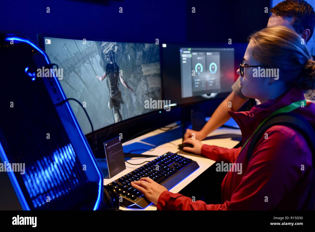 Young woman playing video game on Dell computer, CES (Consumer Electronics Show), the world’s largest technology trade show, held in Las Vegas, USA. Stock Photo