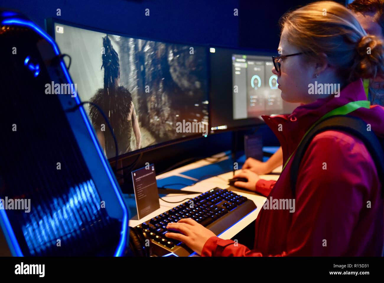 Young woman playing video game on Dell computer, CES (Consumer Electronics Show), the world’s largest technology trade show, held in Las Vegas, USA. Stock Photo