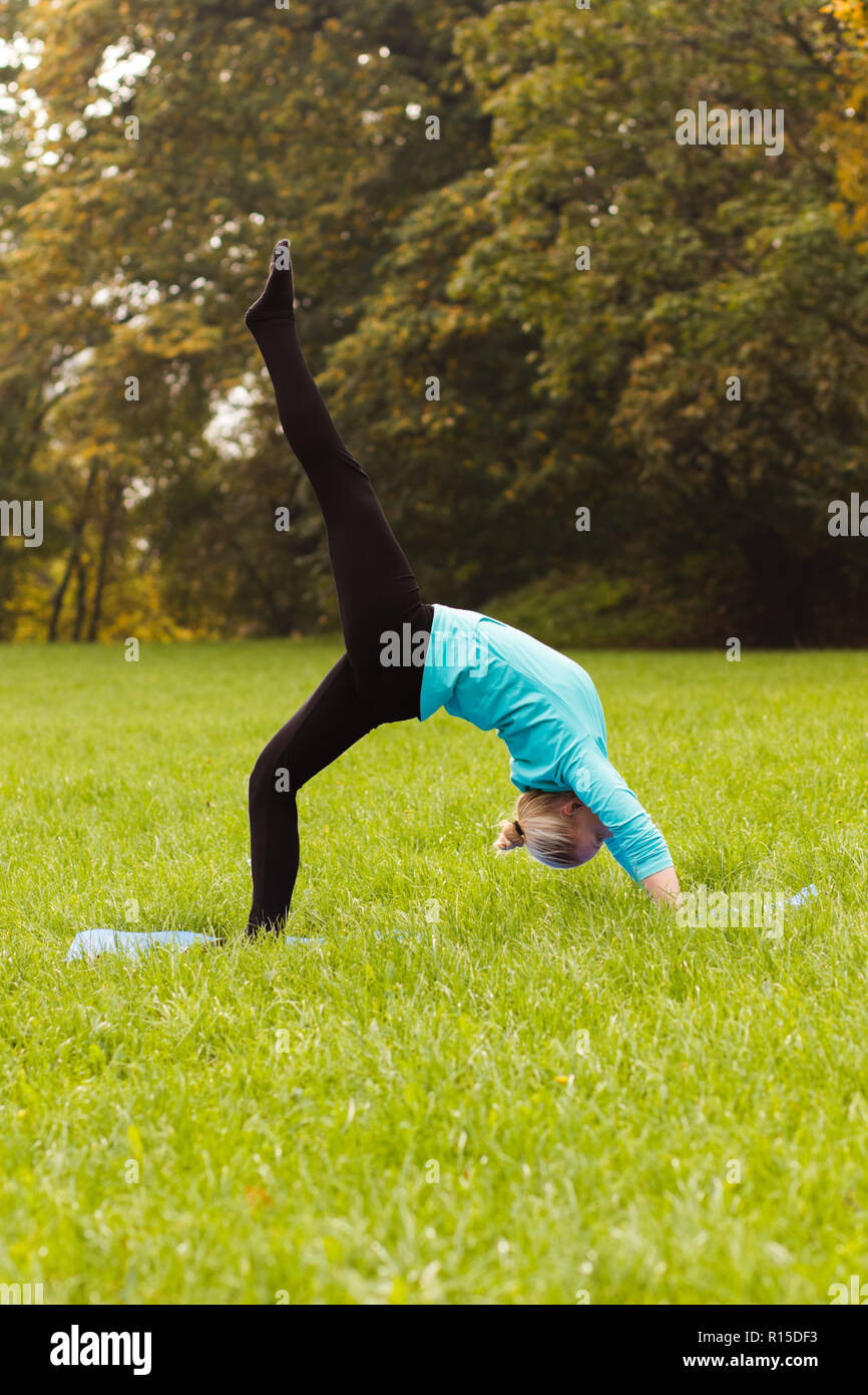 Yoga-Bridge pose with left leg up/Ekopada Dhanurasana Stock Photo