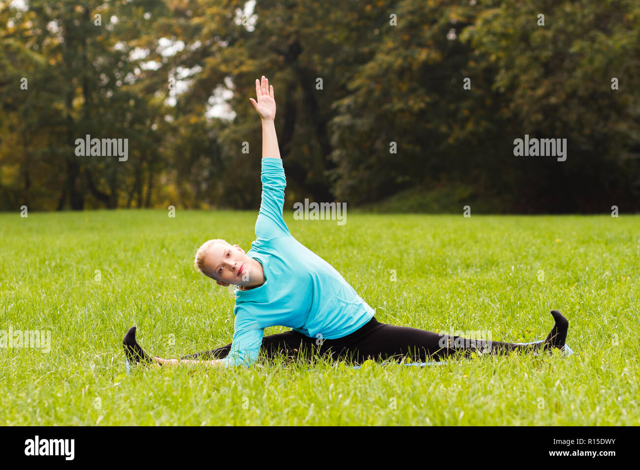 Yoga- Revolved Seated Angle Pose/Upavistha Konasana Stock Photo