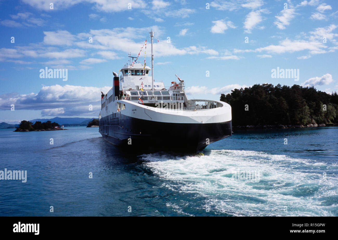 Norway, Hordaland, Transport, The gas powered car ferry Fanafjord leaving Halhjem for Sandvikvag on Island of Stord part of the E39 coastal road. Stock Photo