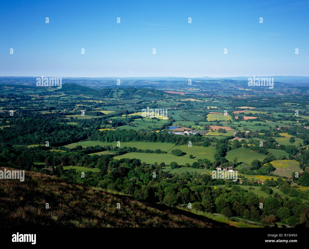 England, Herefordshire, View south west from the Malvern Hills across patchwork of agricultural land and small clusters of buildings. Stock Photo