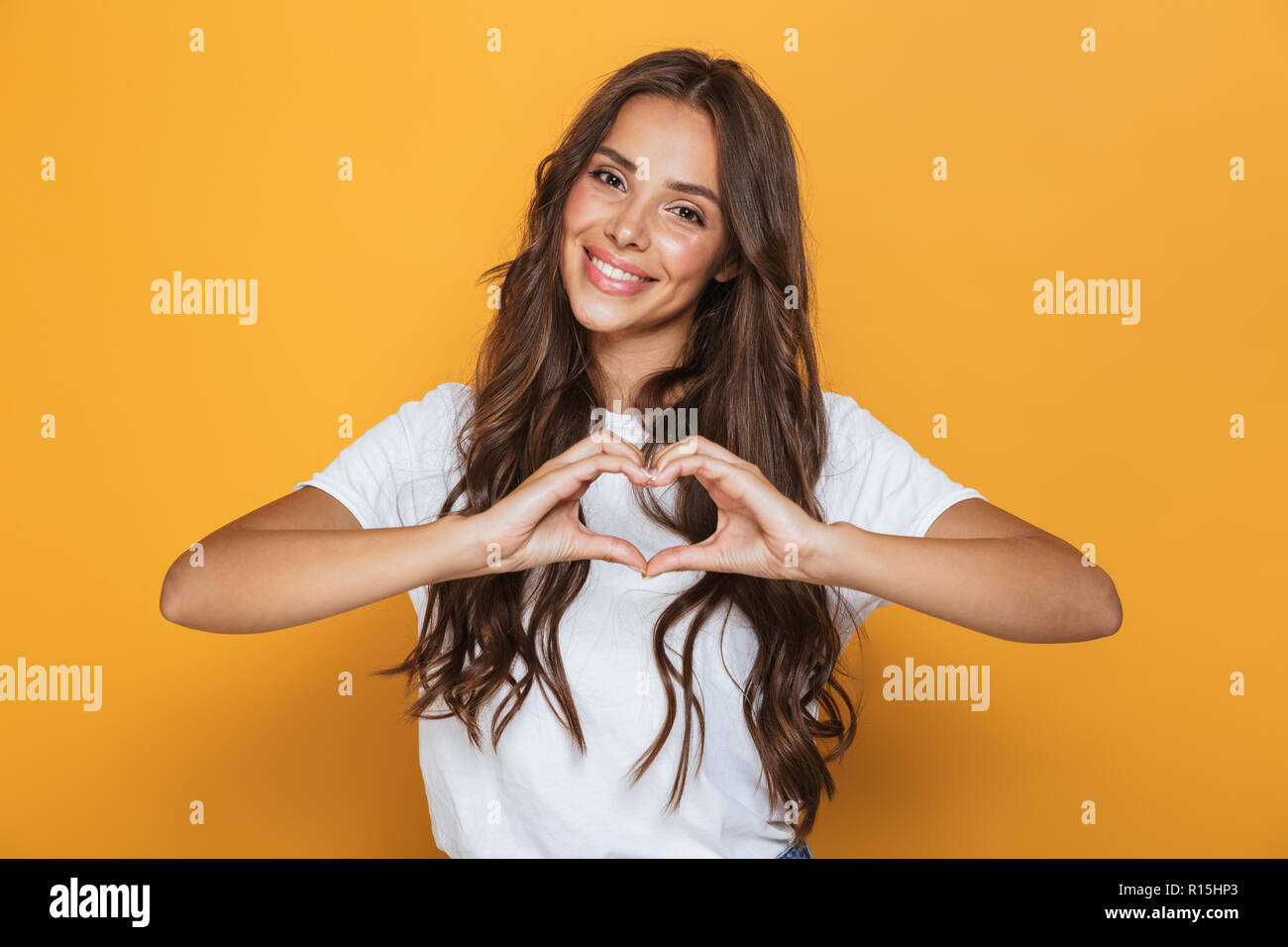 Image Of Charming Woman 20s With Long Hair Smiling And Showing