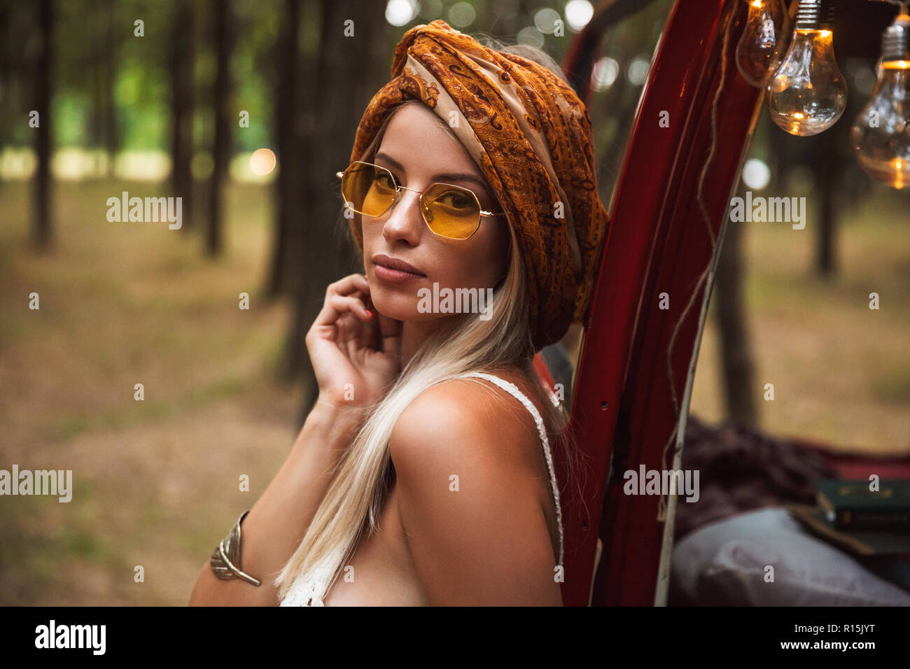 Photo of gorgeous hippy woman wearing stylish accessories looking ...