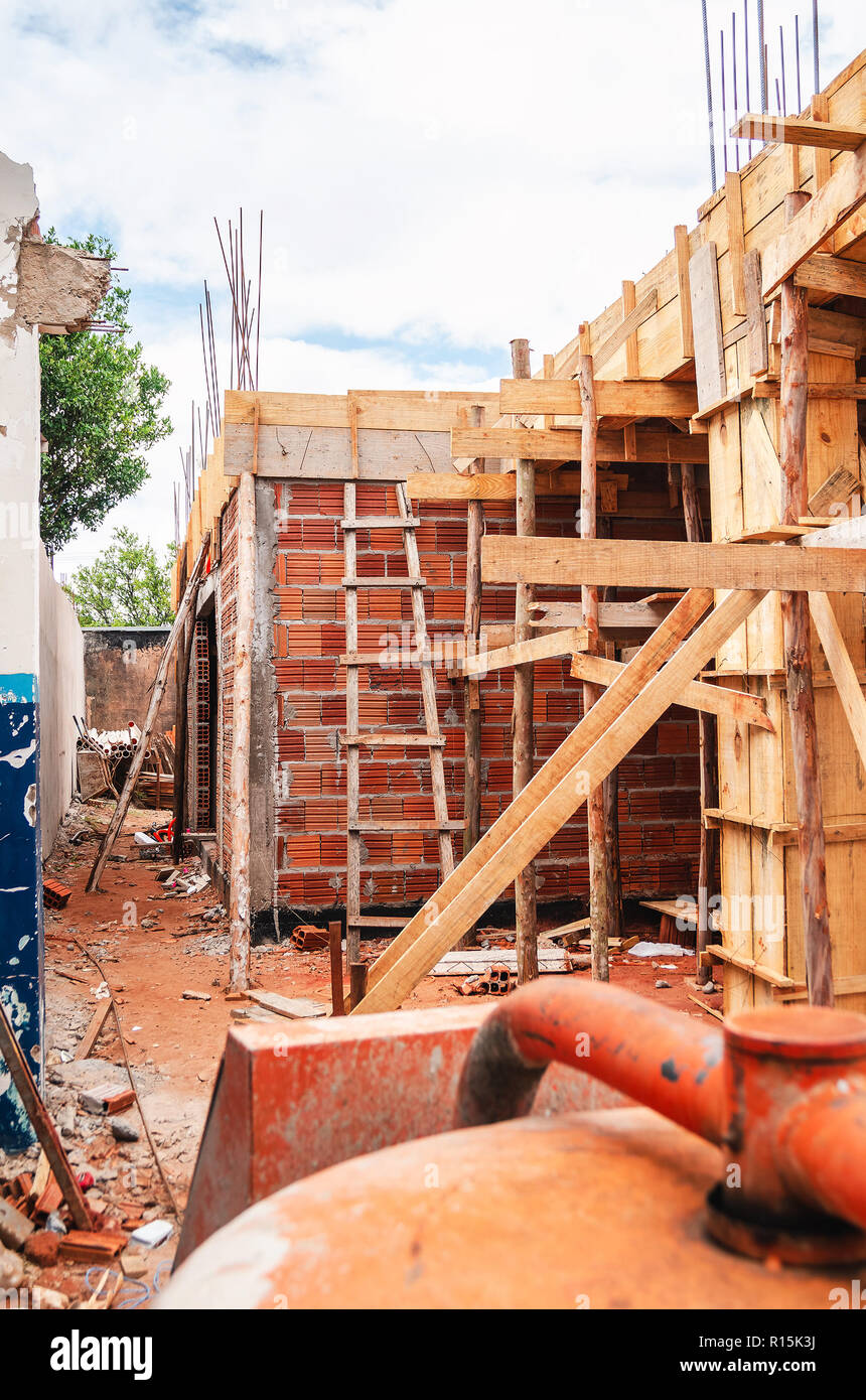 Construction of a masonry house. House made of bricks, steel rebars and