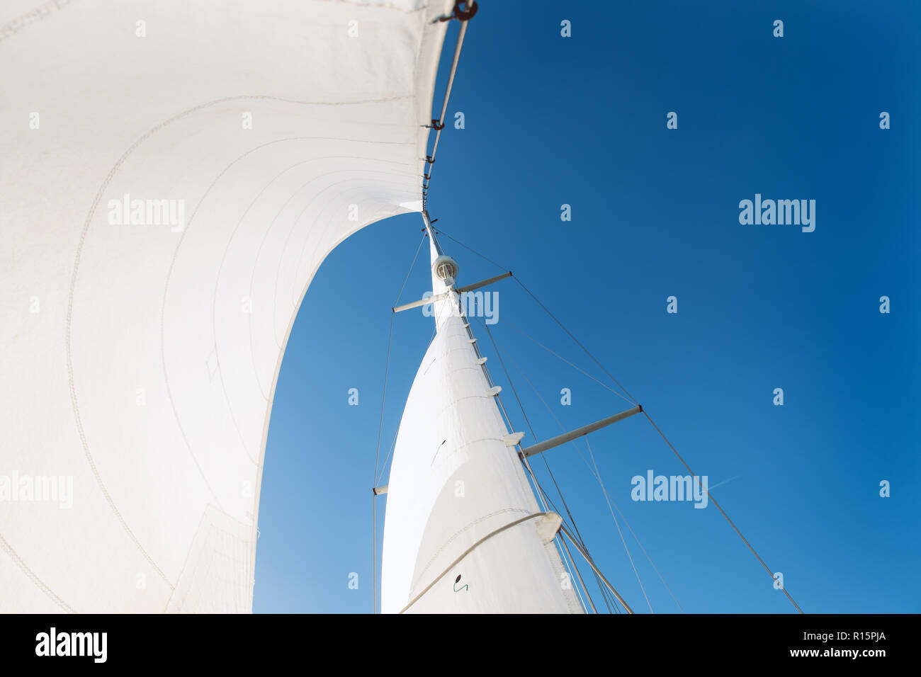 Full sails against blue sky Stock Photo