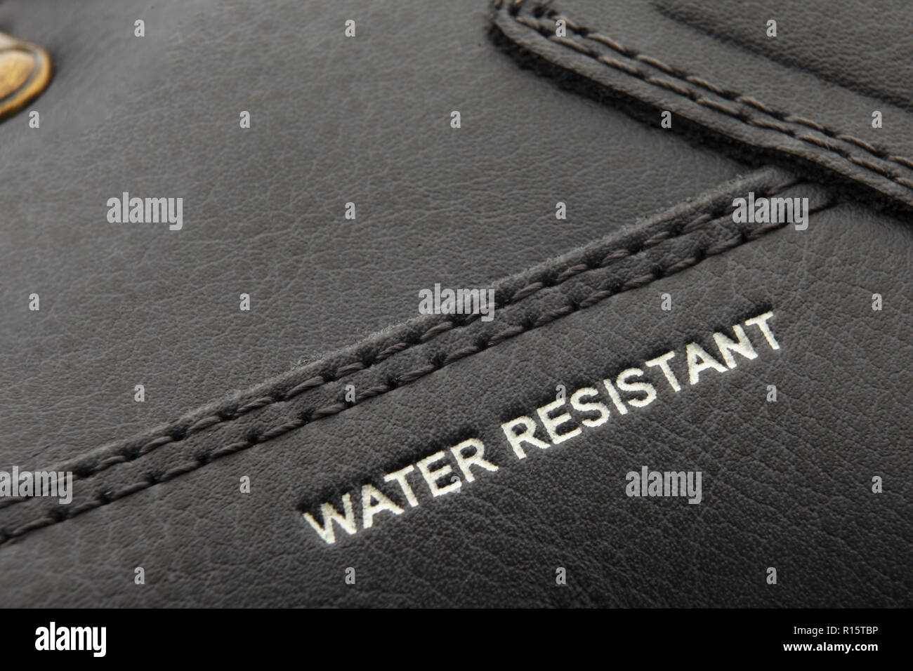 leather boots stitched with thread macro Stock Photo