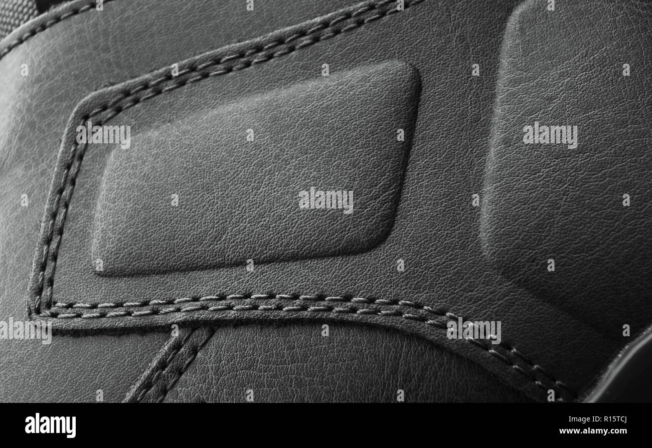 leather boots stitched with thread macro Stock Photo