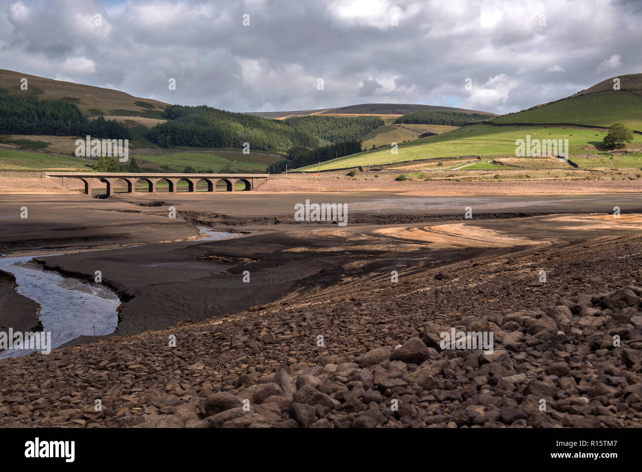 General view of extremely low water levels in Woodhead Reservoir, part of the Longdendale Reservoir system in the High Peak District Stock Photo