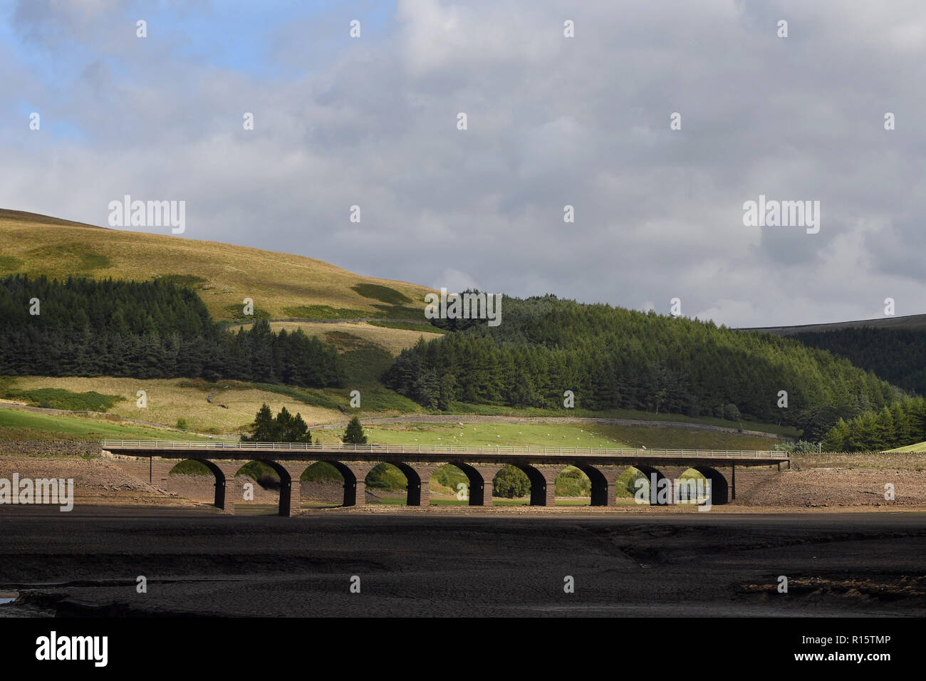 General view of extremely low water levels in Woodhead Reservoir, part of the Longdendale Reservoir system in the High Peak District Stock Photo