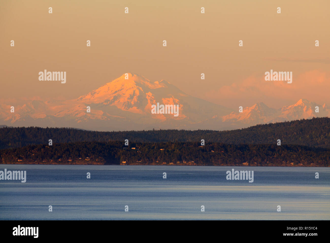 Mt. Baker in evening light rising behind the San Juan Island and Haro