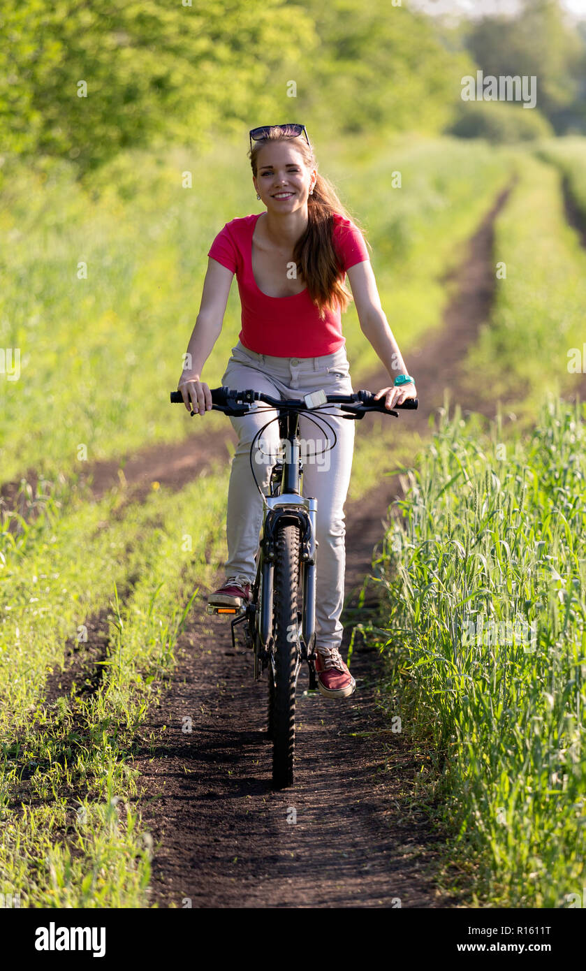 Cute young girl on bicycle Stock Photo