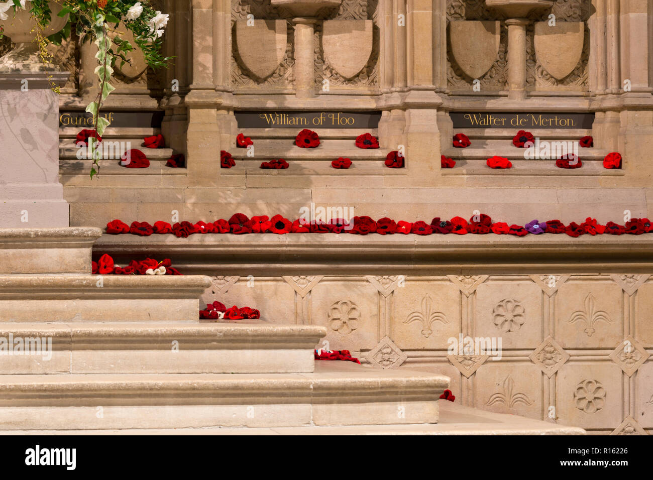 Hand-knitted poppies to commemorate 100 years of the Armistice at Rochester Cathedral, Kent, UK. Stock Photo