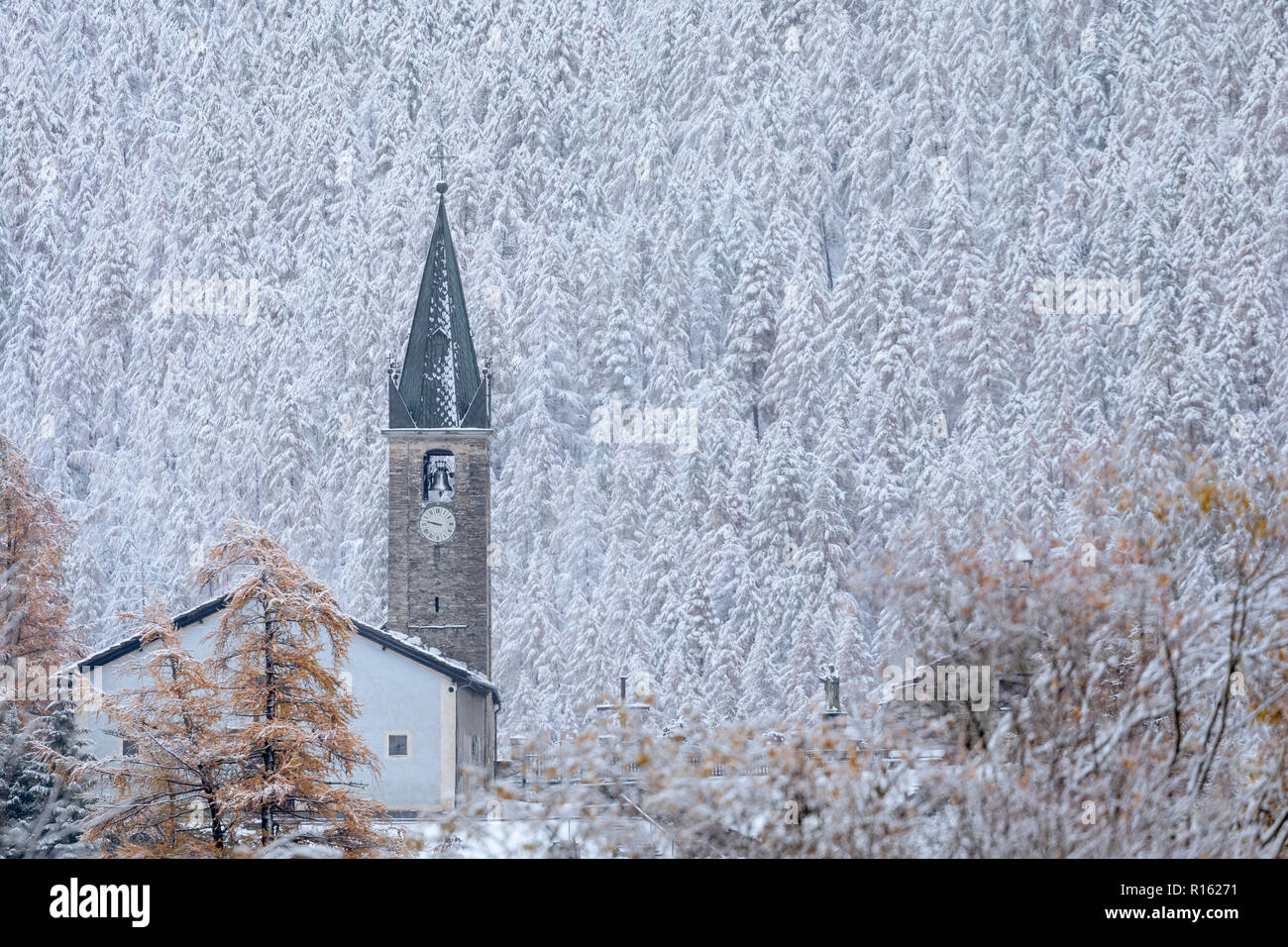 Church with bell covered in snow, Bessans, France 2018. Stock Photo