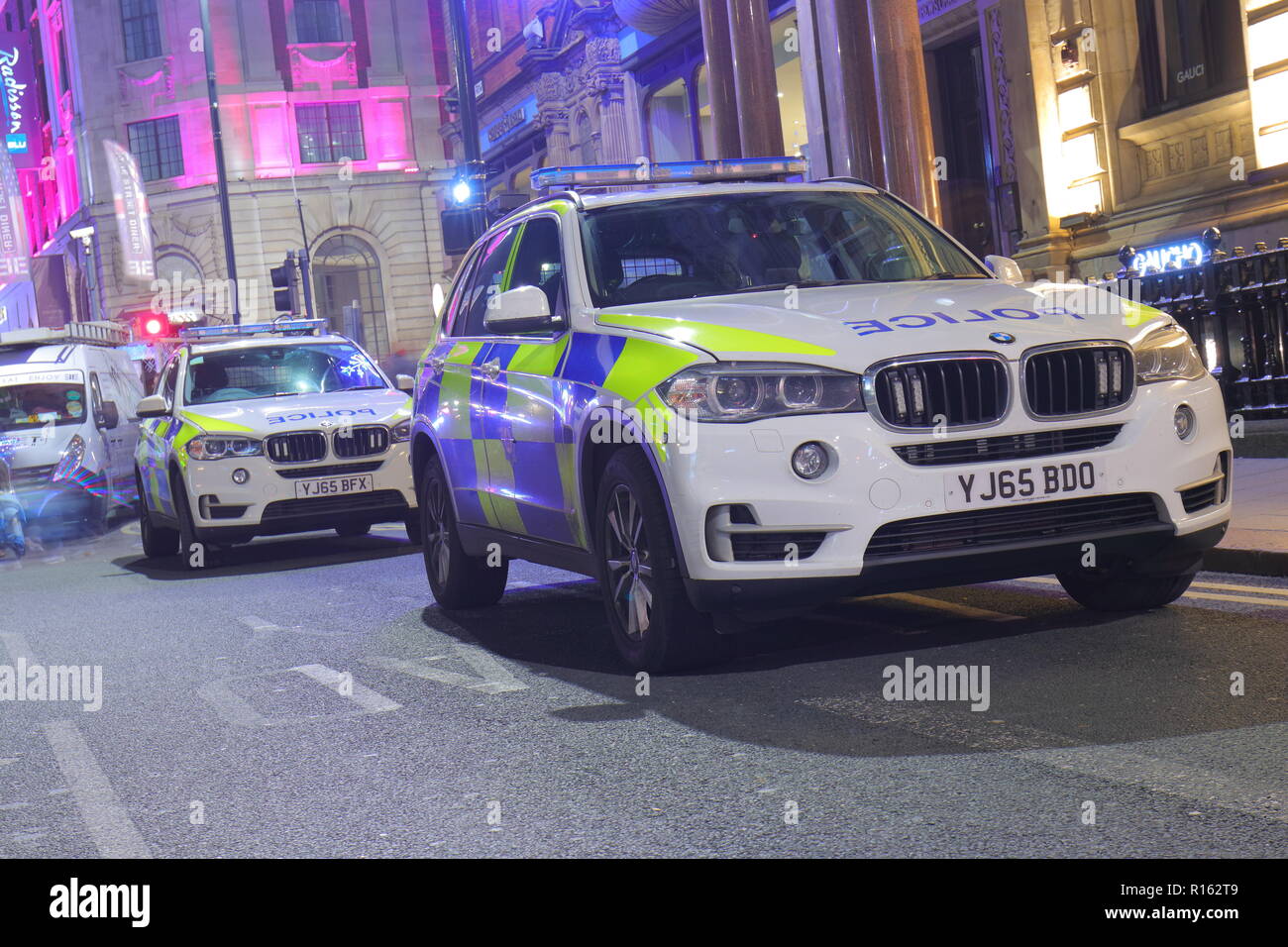 Police vehicles from West Yorkshire Police are parked near to the Leeds Lights Switch On 2018  with officers patrolling on foot to protect the city. Stock Photo