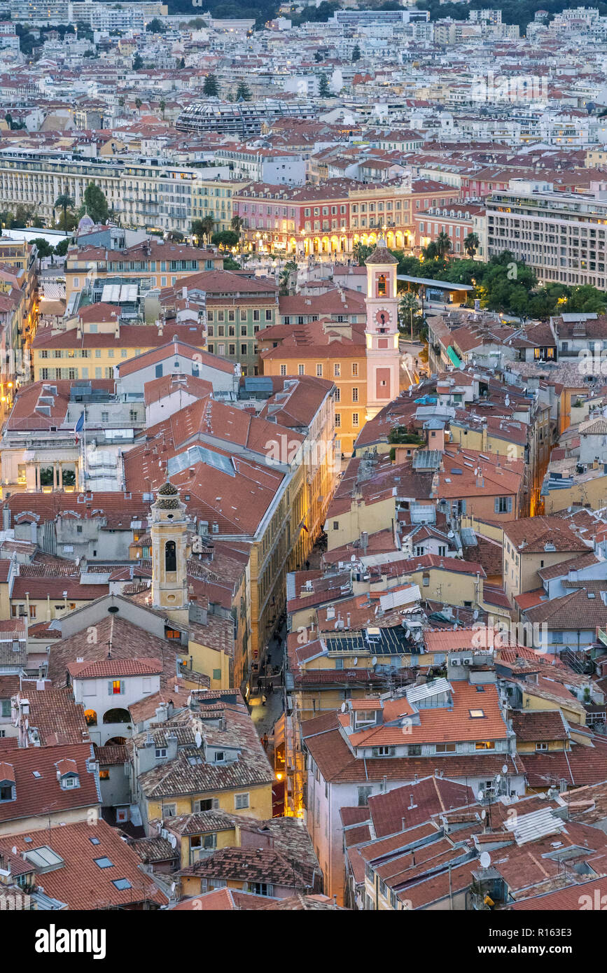 Picturesque Old town of Nice, France. Close up picture of an old houses and churches with little narrow streets lighted in the evening. Stock Photo