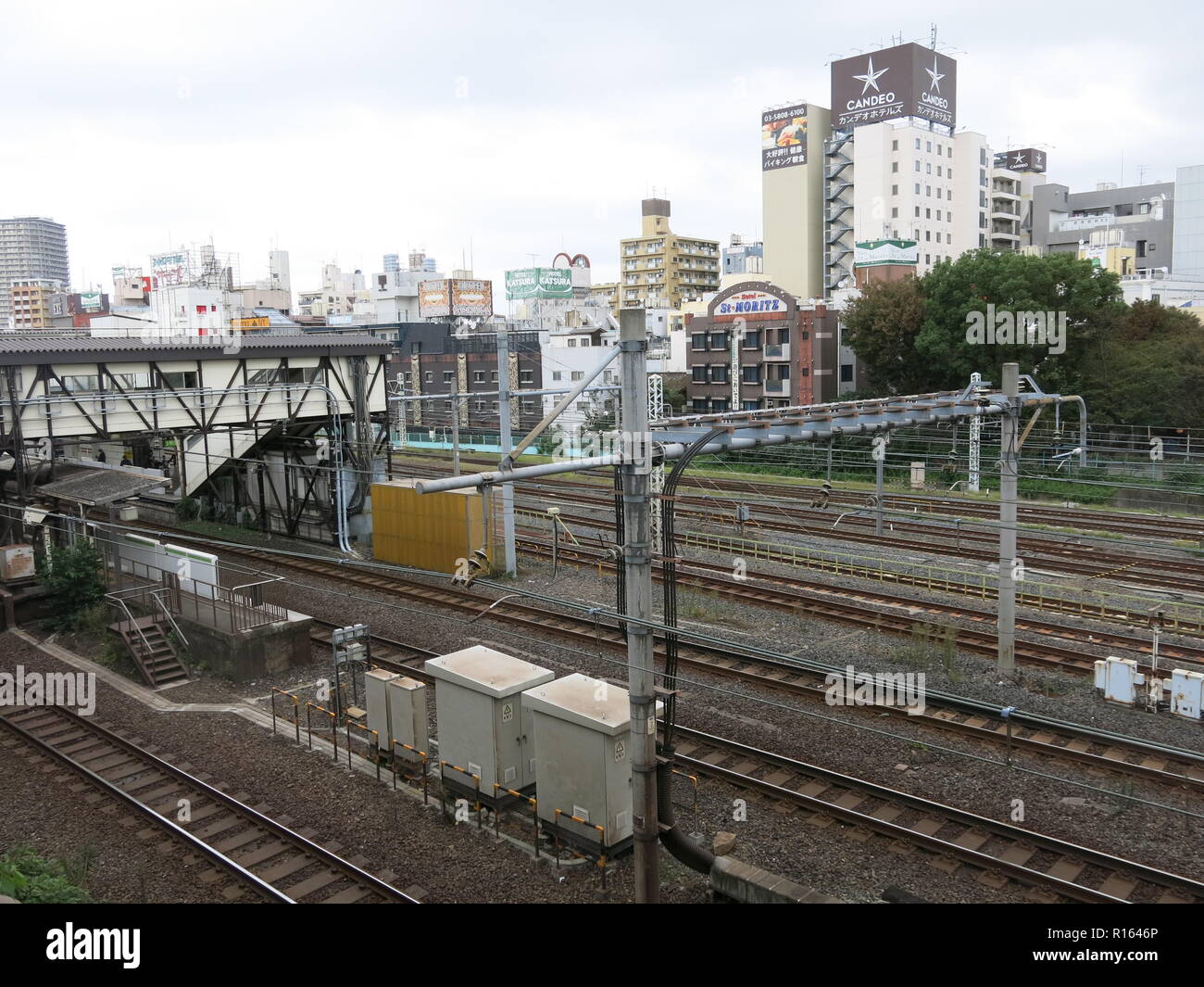 A view of central Tokyo from the window of a train on the Yamanote Line (JR East), Tokyo to Meguro: high density of buildings and railtracks; Japan Stock Photo