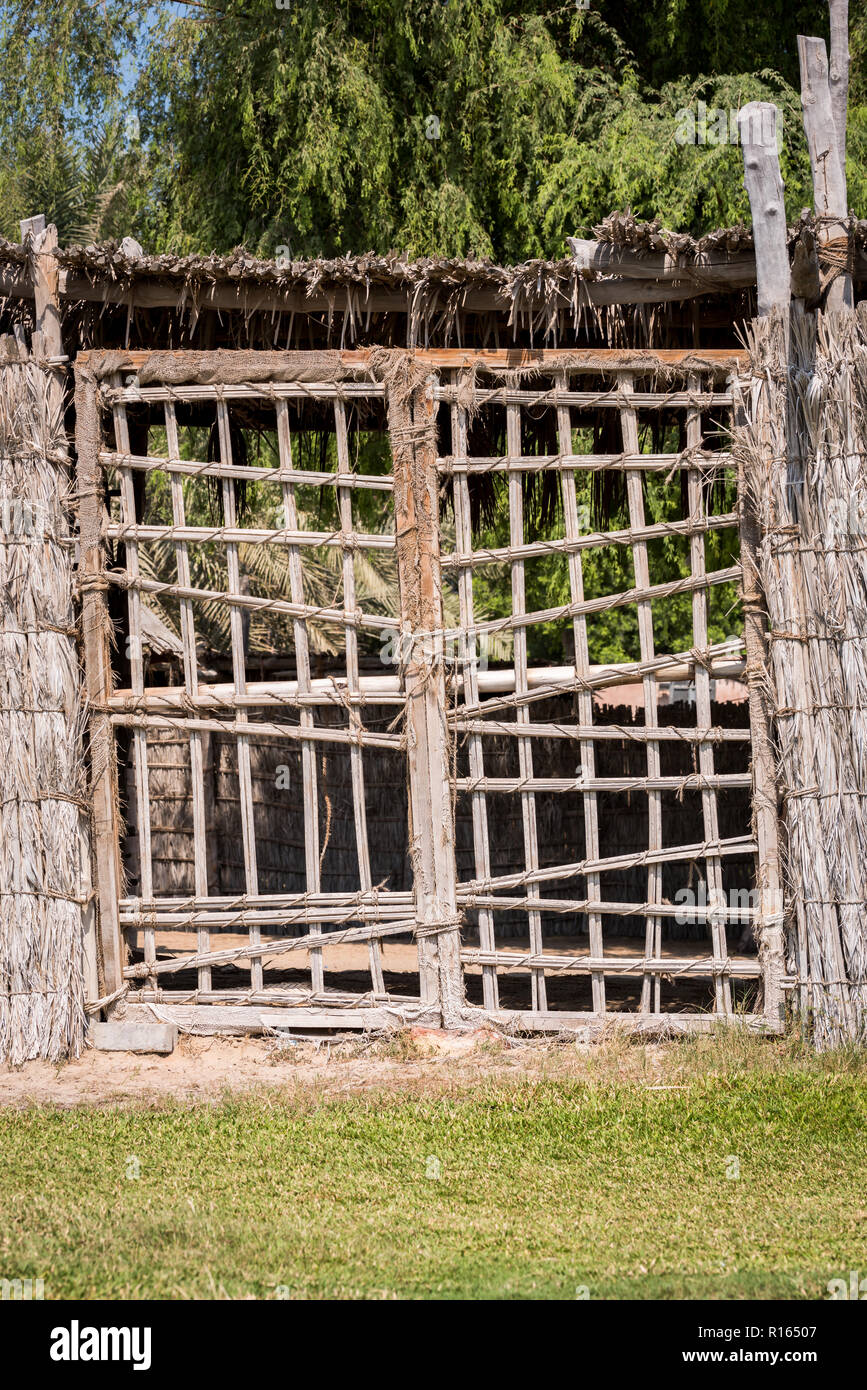 Old traditional hand made door with sticks at Abu Dhabi Heritage Village Stock Photo