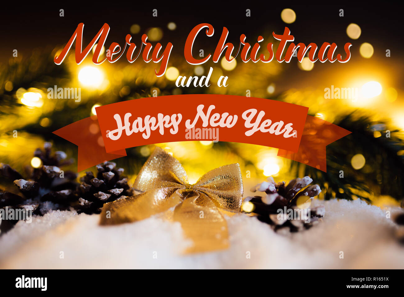 christmas and new year card with christmas decoration on snow and bokeh lights Stock Photo