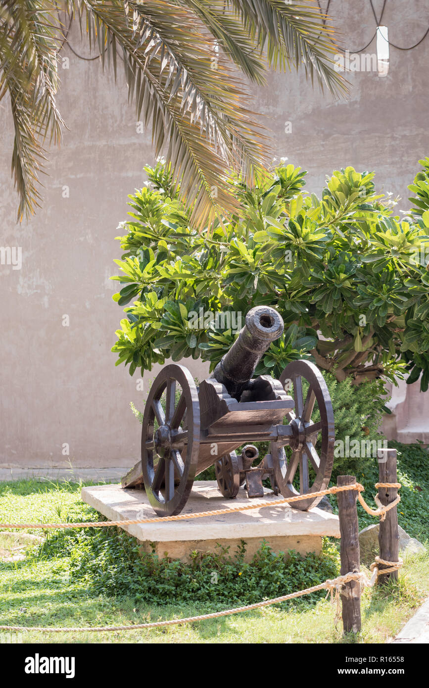 Two wheeled miniature cannon artillery at Heritage Village, Abu Dhabi, UAE Stock Photo