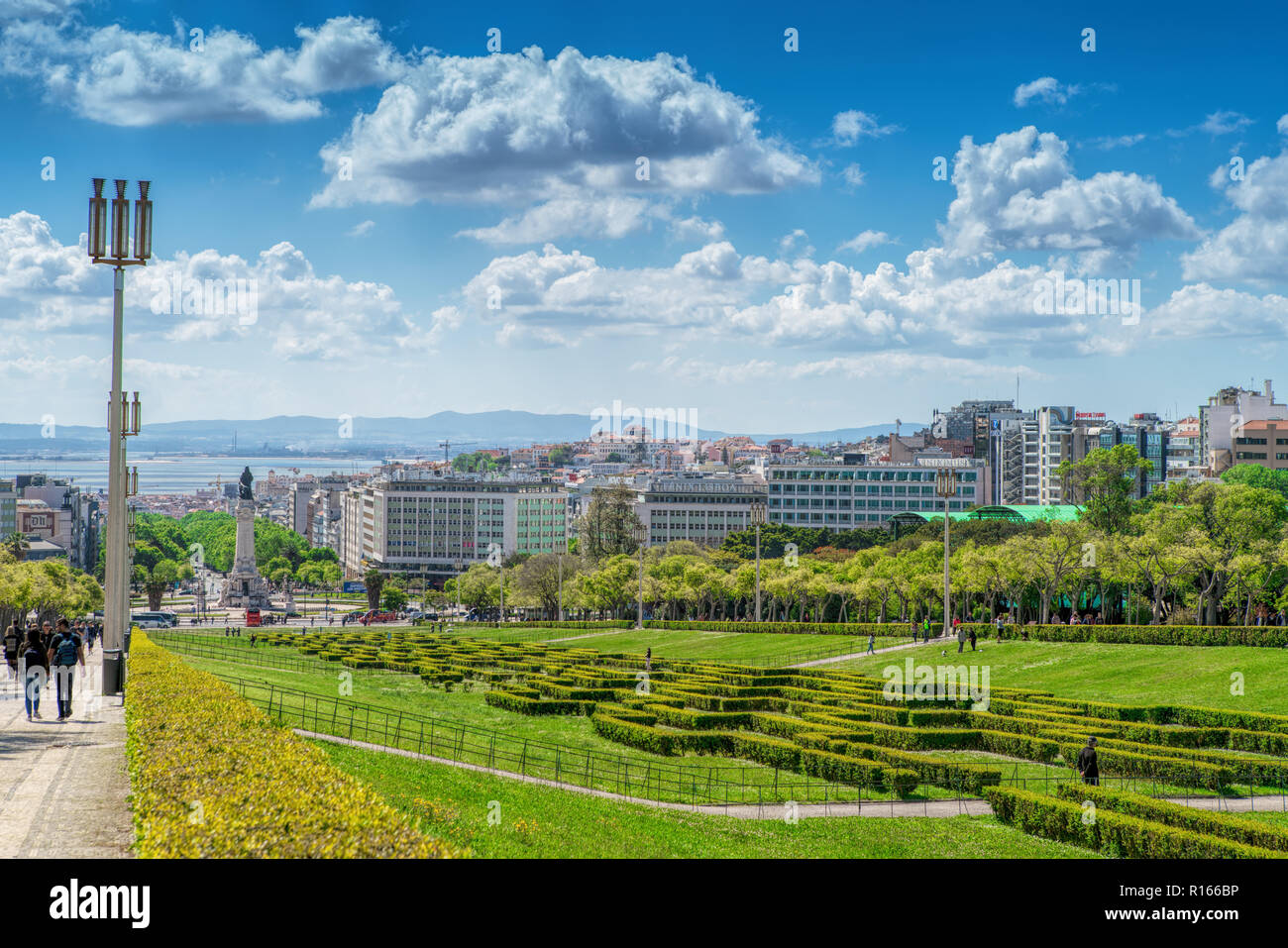 Sloped scenic park featuring tree-lined walking paths. Lisbon Portugal Stock Photo