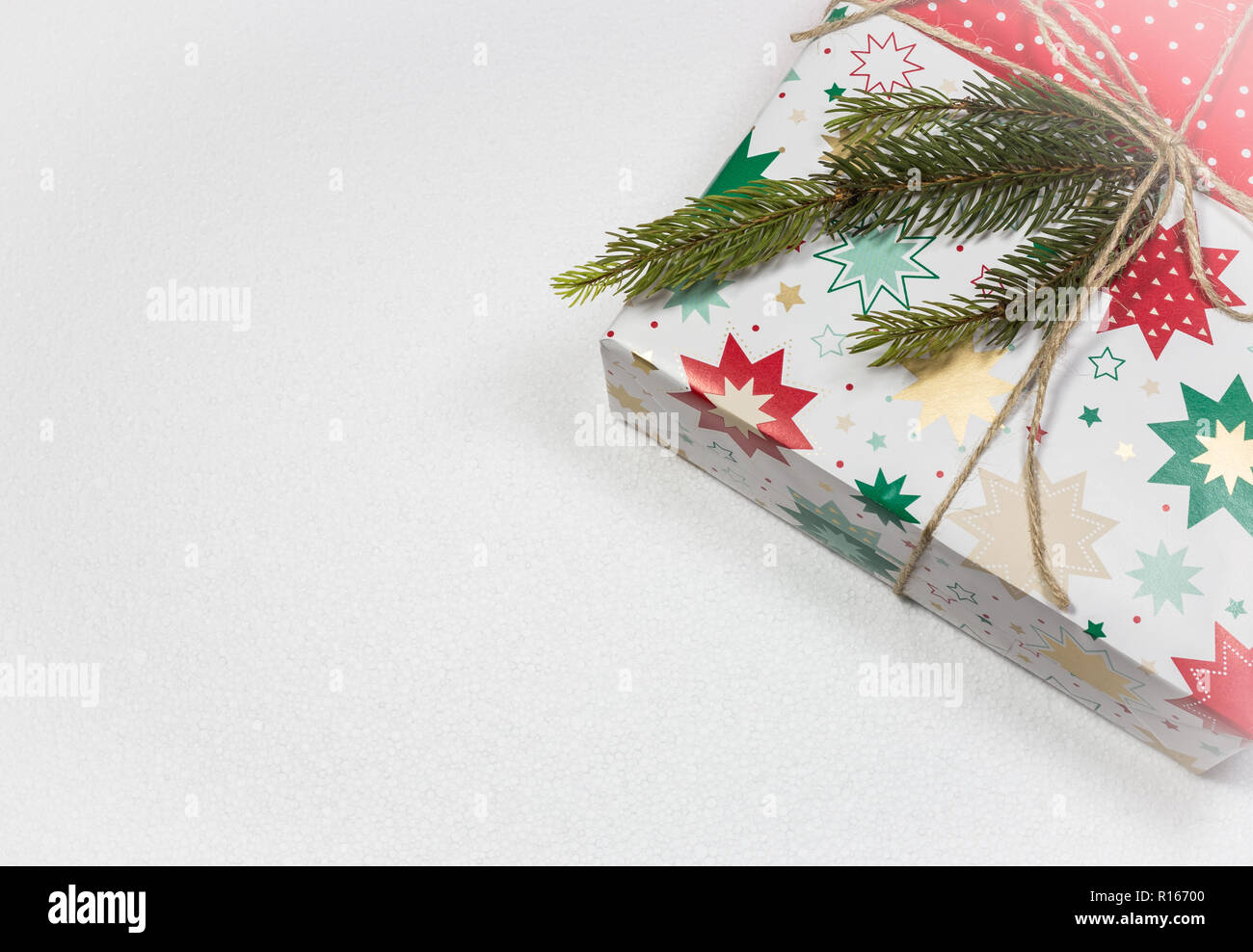 Gift box and fir tree isolated on white background. Top view with copy space. Christmas and New Year holidays background Stock Photo