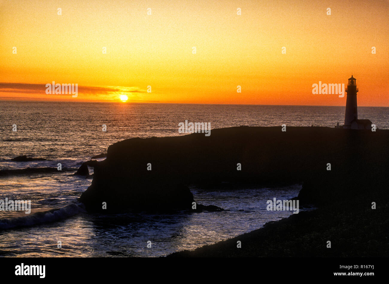 North America; United States; Pacific Ocean; Oregon; Oregon Coast; Yaquina Head Lighthouse; Sunset; Stock Photo