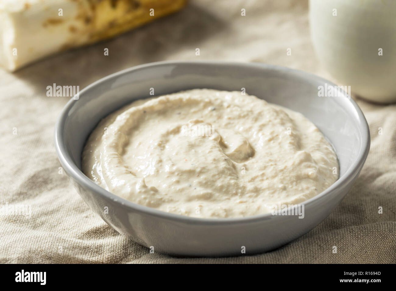 Spicy Homemade Horseradish Sauce in a Bowl Stock Photo