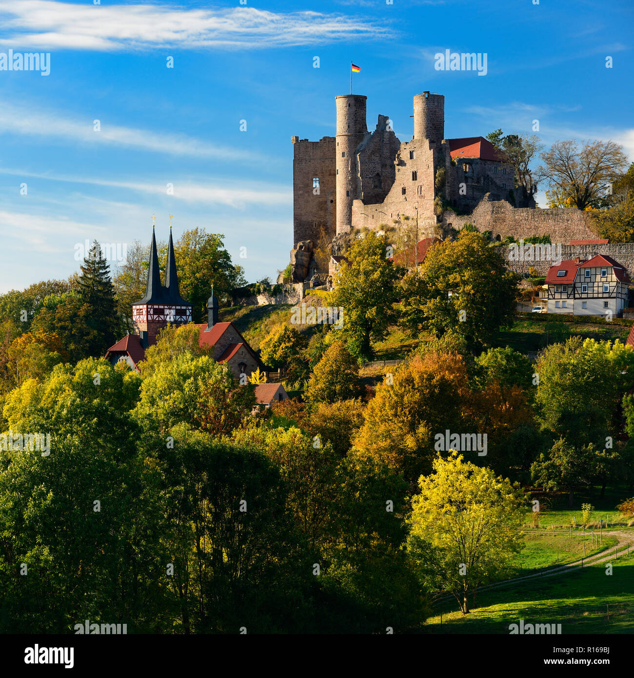 Ruin of Hanstein Castle above the village of Rimbach in autumn, Bornhagen, Eichsfeld, Thuringia, Germany Stock Photo