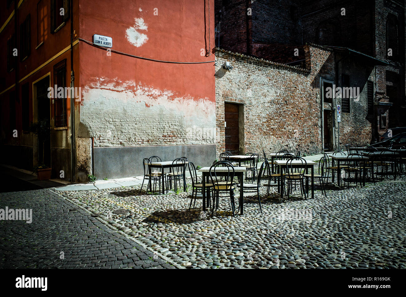 Outdoor space of a café in the historical district of Mantova, Italy Stock Photo