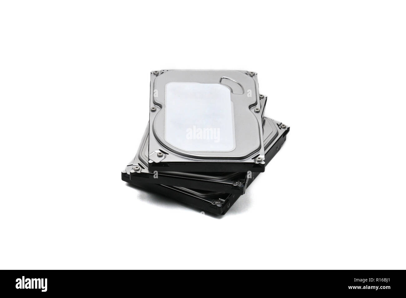 Internal parts of a hard disk on an isolated white background. Stock Photo