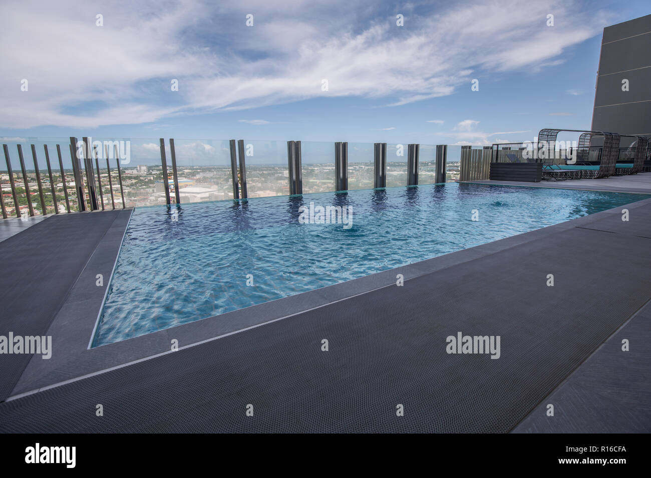 Roof top hotel pool with spa section and a nice view in a relax scenery Stock Photo