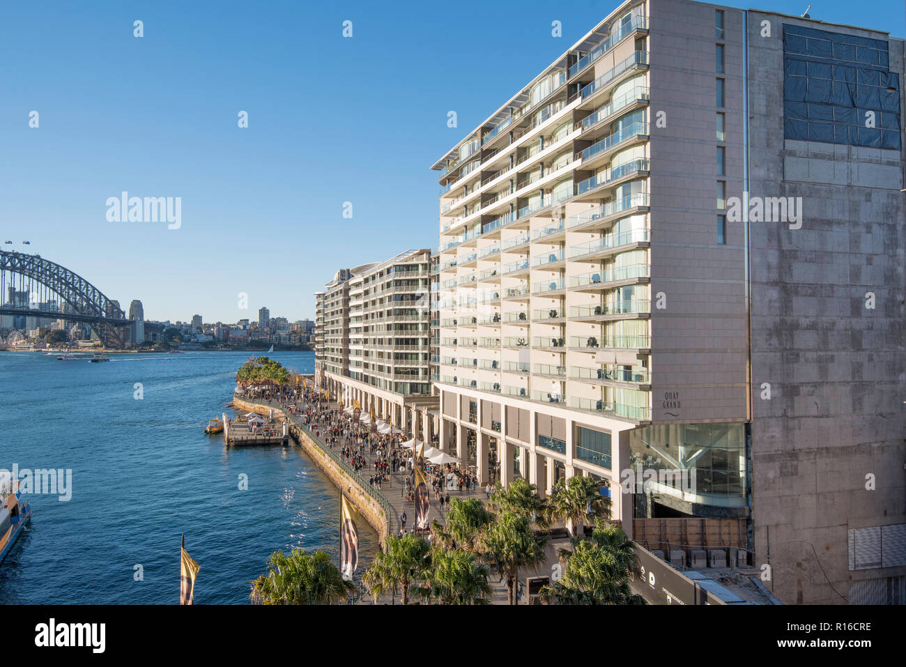 With the Sydney Harbour Bridge at rear, apartment buildings including the infamous 'Toaster' line the waterfront of East Circular Quay, Sydney Harbour Stock Photo