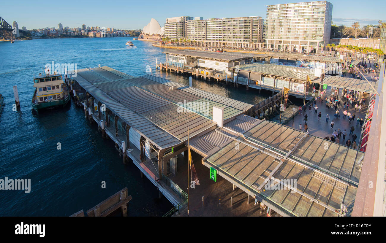 With the Sydney Opera House at rear, apartment buildings including the infamous 'Toaster' line the waterfront of East Circular Quay, Sydney Harbour Stock Photo