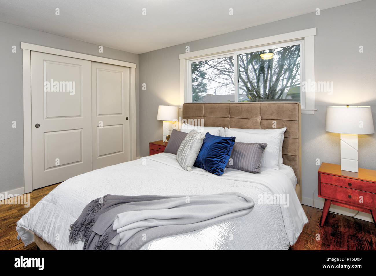 Gray Bedroom Interior With Huge Bed Tufted Headboard And Hardwood