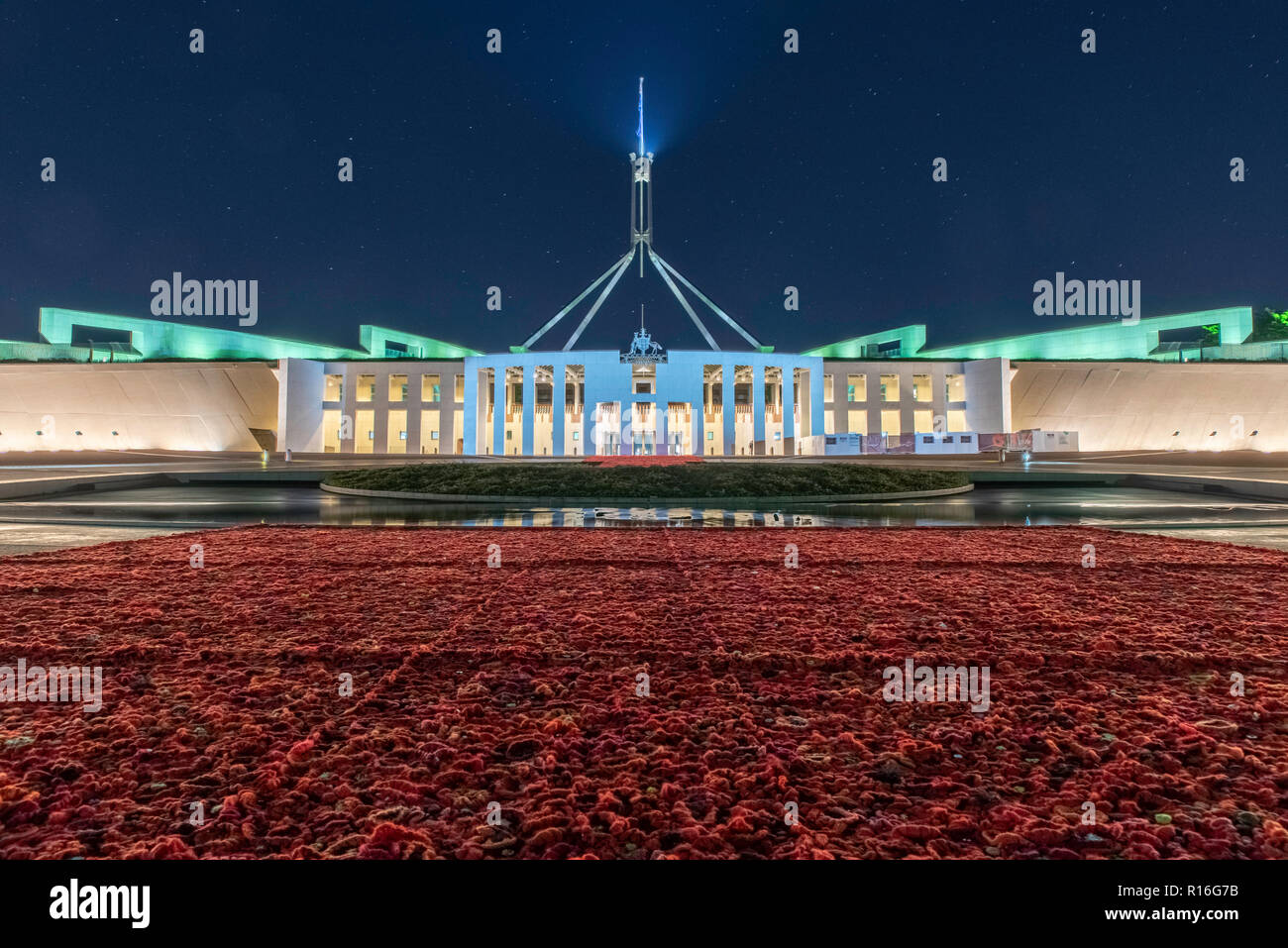 Canberra, Australia. 9th Nov, 2018. 270,000 handmade poppies fill the forecourt at Parliament House in Canberra, to honor Australians who have served in conflicts and peacekeeping operations, marking the 100th anniversary of the signing of the Armistice, ending World War I. Credit: Michael Miller/Alamy Live News Stock Photo