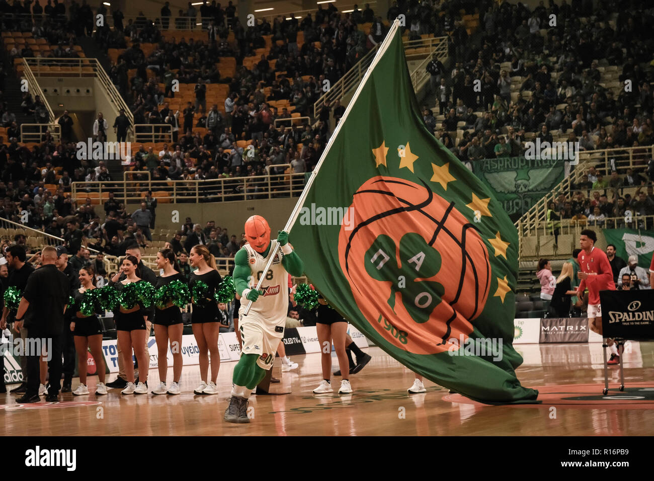 Athens, Greece. 9th Nov, 2018. Panathinaikos OPAP Athens mascot waves a  flag during the 2018/2019 Turkish Airlines EuroLeague Regular Season Round  6 game between Panathinaikos OPAP Athens and Olympiacos Piraeus at Olympic