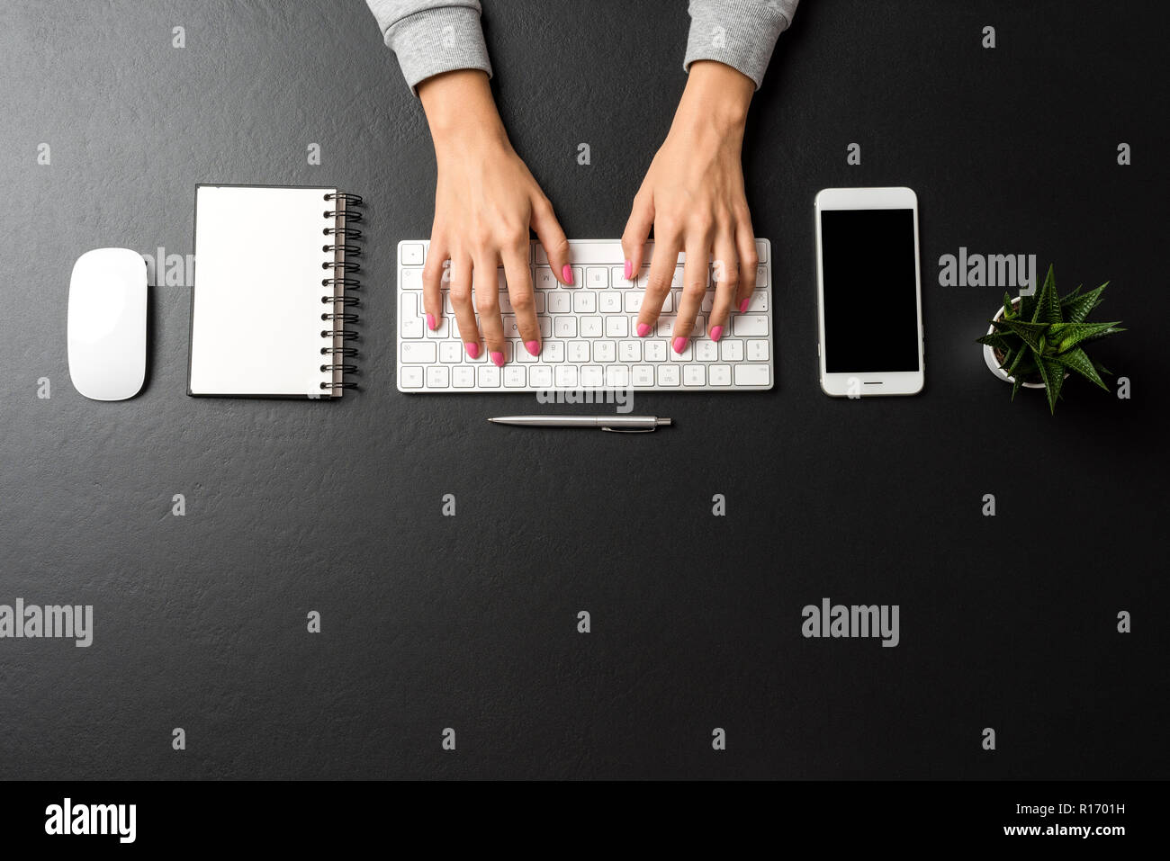 Overhead shot of woman working in office. Copy space Stock Photo