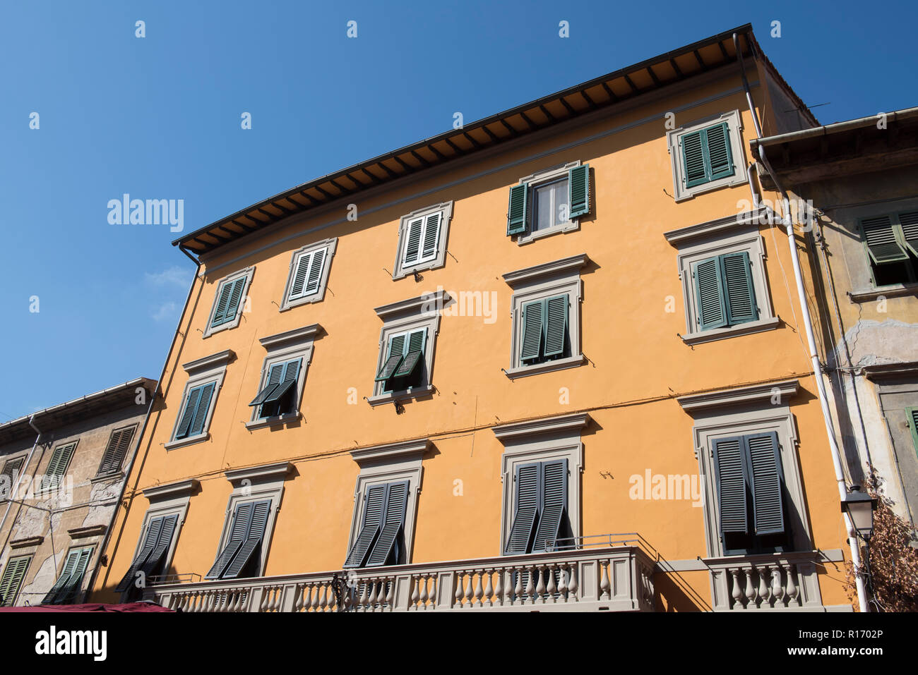 Exterior of a colourful apartment building Pisa, Tuscany Italy Stock