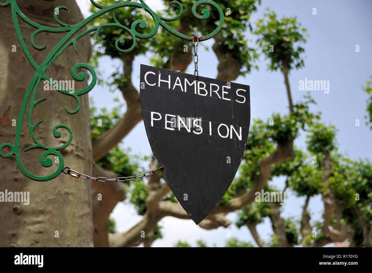 Sign with French text for rooms and boarding house at country side in